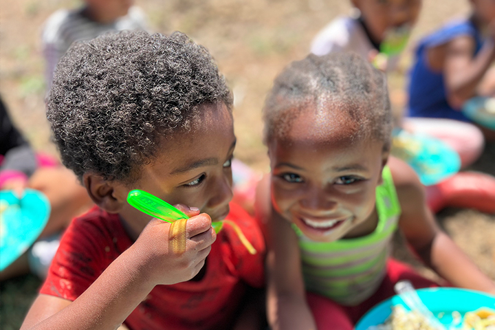 Students from the EQuivalence community outreach program sharing a meal and smiling together at the Durbanville facility in Cape Town.